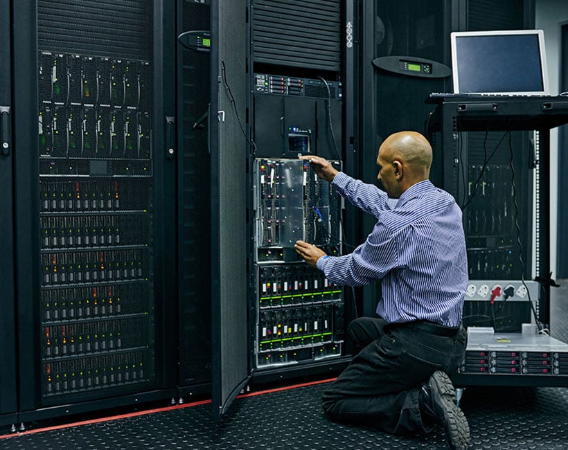 Network engineer upgrading server hardware to enhance IT capabilities.