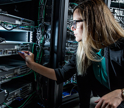 Technician evaluating IT hardware for valuation during the asset recovery process.